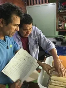 researchers examining data sheets